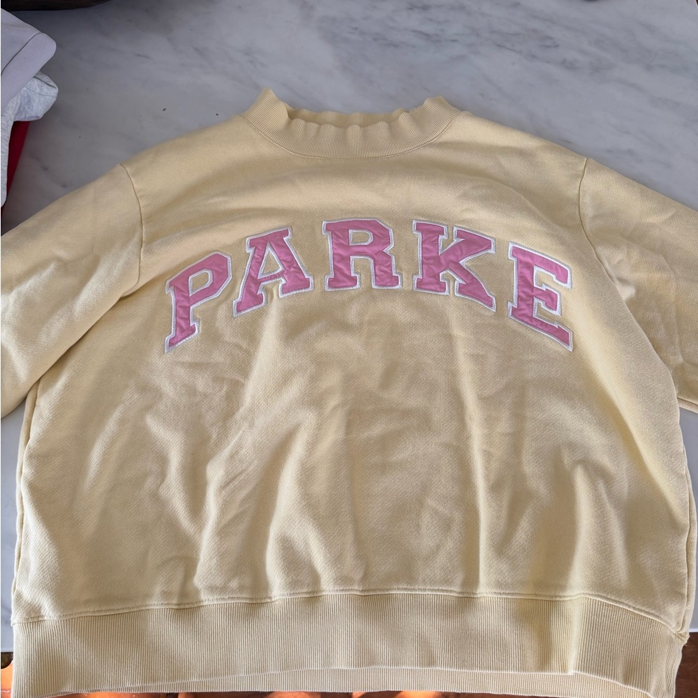 Parke Conch Peel Yellow Sweatshirt with Pink Lettering